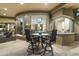 Stone patio with small table and chairs, offering views of the interior at 27264 N 103Rd Way, Scottsdale, AZ 85262