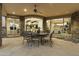 Covered patio with seating for dining and views into the home at 27264 N 103Rd Way, Scottsdale, AZ 85262