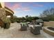 Spacious flagstone patio with comfortable seating and a fire pit at 27264 N 103Rd Way, Scottsdale, AZ 85262