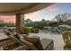 Relaxing pool and spa area with a waterfall feature and stunning sunset views at 27264 N 103Rd Way, Scottsdale, AZ 85262