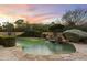 Inviting pool with a waterfall feature and flagstone patio at 27264 N 103Rd Way, Scottsdale, AZ 85262