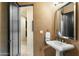 Modern powder room with pedestal sink and dark vanity at 27264 N 103Rd Way, Scottsdale, AZ 85262