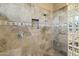 Walk-in shower with neutral tile and glass block wall at 27264 N 103Rd Way, Scottsdale, AZ 85262