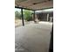 Back patio with furniture and a view of the backyard featuring mature landscaping and a wooden fence at 4232 W Citrus Way, Phoenix, AZ 85019