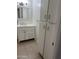 Bathroom featuring a single sink vanity, tiled floor and lots of storage at 4232 W Citrus Way, Phoenix, AZ 85019