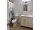 Bathroom featuring a toilet, vanity, mirror, and a shower with a decorative curtain at 4232 W Citrus Way, Phoenix, AZ 85019