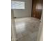 Bedroom with neutral paint, and tile floors. A bright window offers natural light at 4232 W Citrus Way, Phoenix, AZ 85019