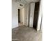 Light-filled room with neutral paint, tiled floor, closet and view of other rooms at 4232 W Citrus Way, Phoenix, AZ 85019
