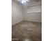 Clean bedroom with tile flooring, a ceiling fan, and a window for natural light at 4232 W Citrus Way, Phoenix, AZ 85019
