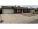 Exterior view of home featuring an attached garage and desert landscaping at 4232 W Citrus Way, Phoenix, AZ 85019