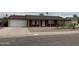 Single-story brick home with an attached garage and a small front yard with desert landscaping at 4232 W Citrus Way, Phoenix, AZ 85019
