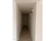 The long hallway has white walls and tile flooring at 4232 W Citrus Way, Phoenix, AZ 85019