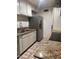 Bright kitchen with stainless steel refrigerator and granite countertops at 4232 W Citrus Way, Phoenix, AZ 85019
