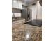 Bright kitchen with stainless steel refrigerator and granite countertops at 4232 W Citrus Way, Phoenix, AZ 85019