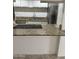 Well-lit kitchen featuring granite countertops and stainless steel appliances at 4232 W Citrus Way, Phoenix, AZ 85019