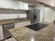 Kitchen featuring granite countertops, stainless steel appliances, and modern cabinets at 4232 W Citrus Way, Phoenix, AZ 85019