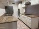 The kitchen features stainless steel appliances, granite countertops, and white cabinets at 4232 W Citrus Way, Phoenix, AZ 85019