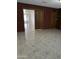 Bright living room featuring brick accents, tiled floors, and an open doorway to the next room at 4232 W Citrus Way, Phoenix, AZ 85019