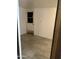 Clean, simple room with white walls, tiled floor, and a single door, perfect for customization at 4232 W Citrus Way, Phoenix, AZ 85019