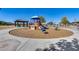 Community playground with playset and wood-chip surface at 30423 W Catalina Dr, Buckeye, AZ 85396