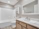 Clean bathroom with a vanity, bathtub, and a mirror at 916 E Beautiful Ln, Phoenix, AZ 85042