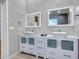 Modern bathroom with double vanity and updated fixtures at 916 E Beautiful Ln, Phoenix, AZ 85042