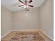Bright bedroom featuring hardwood floors, an area rug, and a modern ceiling fan at 916 E Beautiful Ln, Phoenix, AZ 85042