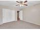 Bright bedroom with ceiling fan and double door closet at 916 E Beautiful Ln, Phoenix, AZ 85042