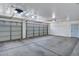Spacious garage with concrete flooring and two paneled garage doors at 916 E Beautiful Ln, Phoenix, AZ 85042