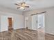 Main bedroom with wood-look floors and access to bathroom and closet at 916 E Beautiful Ln, Phoenix, AZ 85042