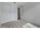 A bright bedroom featuring carpet, a closet, and a doorway at 18605 E Panchito Dr, Gold Canyon, AZ 85118