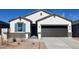 Charming single-Gathering home featuring a gray roof, stucco siding, desert landscaping and a spacious two-car garage at 25316 W Sunland Ave, Buckeye, AZ 85326