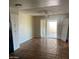 Bright living area featuring tile flooring and sliding glass door at 4147 W Reade Ave, Phoenix, AZ 85019