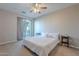 Bright bedroom with a queen-size bed and balcony access at 1406 W Main St # 120, Mesa, AZ 85201