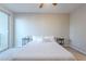 Bedroom with a queen-size bed and access to a balcony at 1406 W Main St # 120, Mesa, AZ 85201