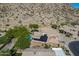Desert home featuring a private pool, solar panels, lush trees and mountain views at 1416 E Sapium Way, Phoenix, AZ 85048