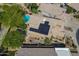 Unique aerial view of home with solar panels, surrounded by trees and grass at 1416 E Sapium Way, Phoenix, AZ 85048