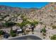 Serene aerial view showcasing a home with a refreshing pool and desert landscaping at 1416 E Sapium Way, Phoenix, AZ 85048
