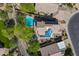View of home with in-ground pool, solar panels and desert landscaping at 1416 E Sapium Way, Phoenix, AZ 85048