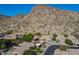 Desirable community boasting a home with solar panels nestled against scenic mountain views at 1416 E Sapium Way, Phoenix, AZ 85048