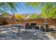 Comfortable outdoor seating arrangement with patio and privacy wall, ideal for relaxing and entertaining guests at 1416 E Sapium Way, Phoenix, AZ 85048
