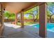Covered patio offering a stunning view of the pool and surrounding landscape, great for relaxation and entertainment at 1416 E Sapium Way, Phoenix, AZ 85048