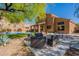 Beautiful backyard featuring a covered patio, lounge furniture, and a sparkling pool, great for outdoor entertaining at 1416 E Sapium Way, Phoenix, AZ 85048