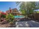 Charming backyard featuring a pool, desert landscaping, and space for entertaining at 1416 E Sapium Way, Phoenix, AZ 85048