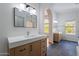Bright bathroom with double vanities, modern lighting, and glass shower, offering ample space and style at 1416 E Sapium Way, Phoenix, AZ 85048