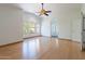 Bright bedroom features hardwood floors, natural light, vaulted ceiling, and access to an en-suite bathroom at 1416 E Sapium Way, Phoenix, AZ 85048