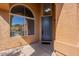 Beautiful entryway with blue front door and arched window at 1416 E Sapium Way, Phoenix, AZ 85048