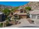 Gorgeous two-story home with a tile roof, desert landscaping, and attached two-car garage at 1416 E Sapium Way, Phoenix, AZ 85048