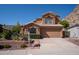 Charming two-story home with desert landscaping and a two-car garage at 1416 E Sapium Way, Phoenix, AZ 85048