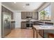 Modern kitchen features stainless steel appliances, ample cabinets, and natural light at 1416 E Sapium Way, Phoenix, AZ 85048